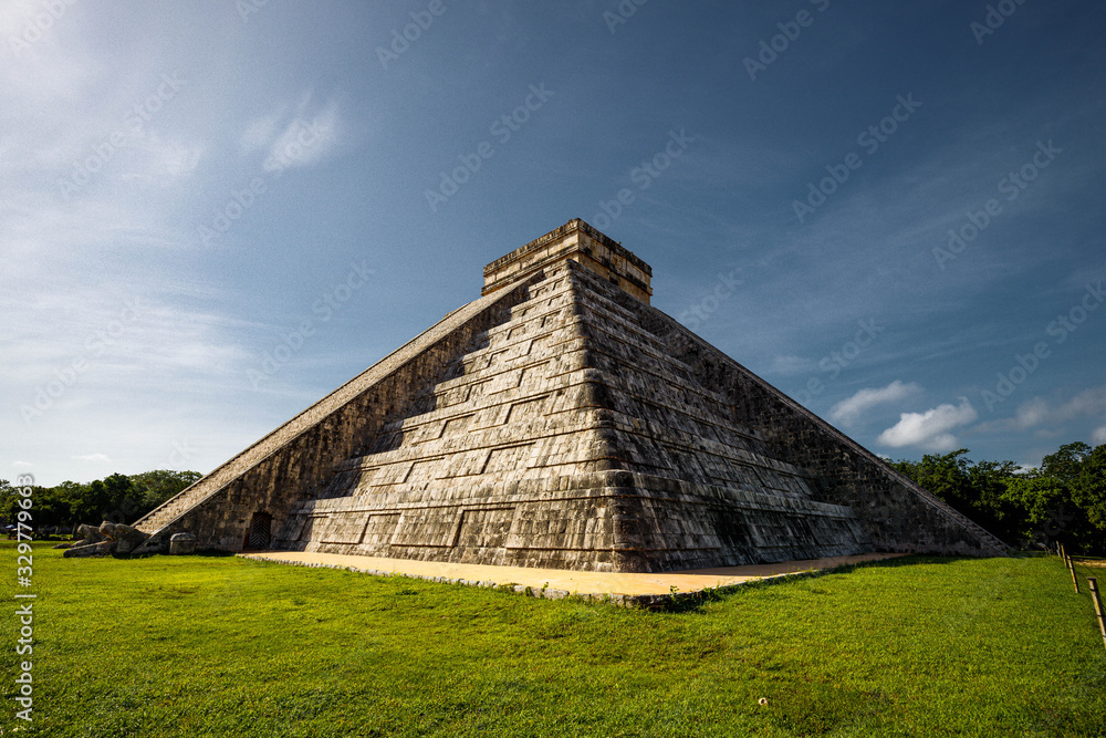 Famous Maya Temple of Kukulcan (Chichen Itza) on Yucatan peninsula during sunrise with no tourists (Yucatan, Mexico, America) Famous Maya Temple of Kukulcan (Chichen Itza) on Yucatan peninsula during sunrise with no tourists (Yucatan, Mexico, America)