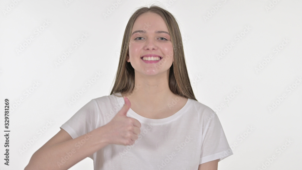 Cheerful Beautiful Young Woman showing Thumbs Up