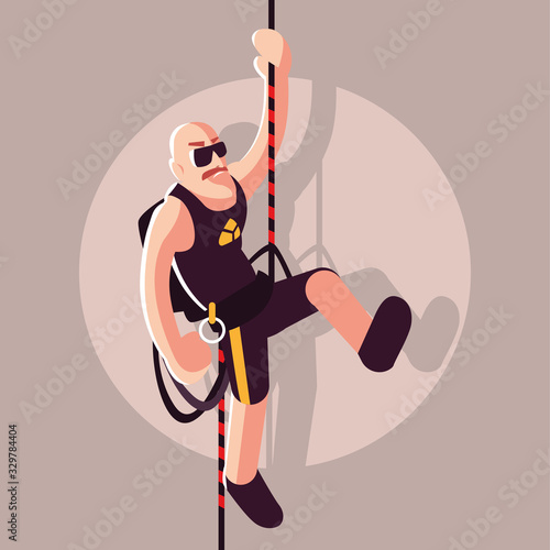 man rock climber with climbing equipment