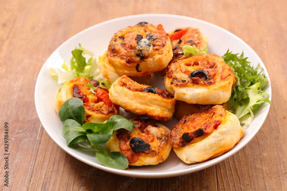 puff pastry roll with olive and tomato sauce-appetizer, finger food, snack puff pastry roll with olive and tomato sauce-appetizer, finger food, snack