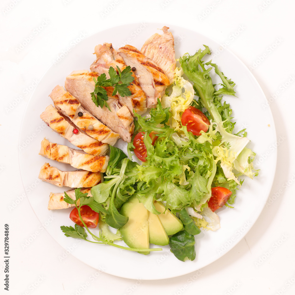 fried chicken fillet with vegetable salad in plate fried chicken fillet with vegetable salad in plate