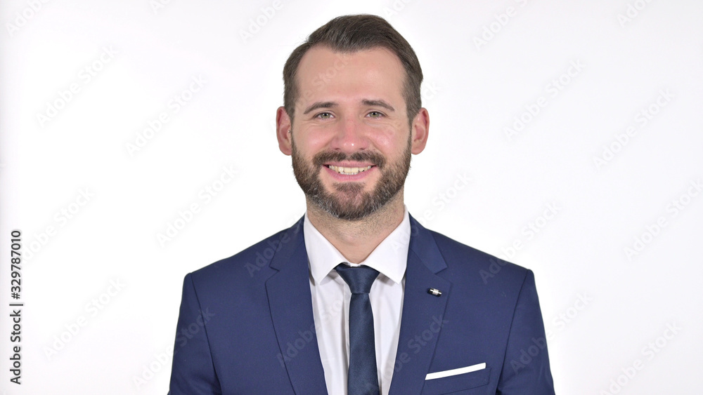 Portrait of Young Businessman Saying Yes by Head Shake, White Background Portrait of Young Businessman Saying Yes by Head Shake, White Background