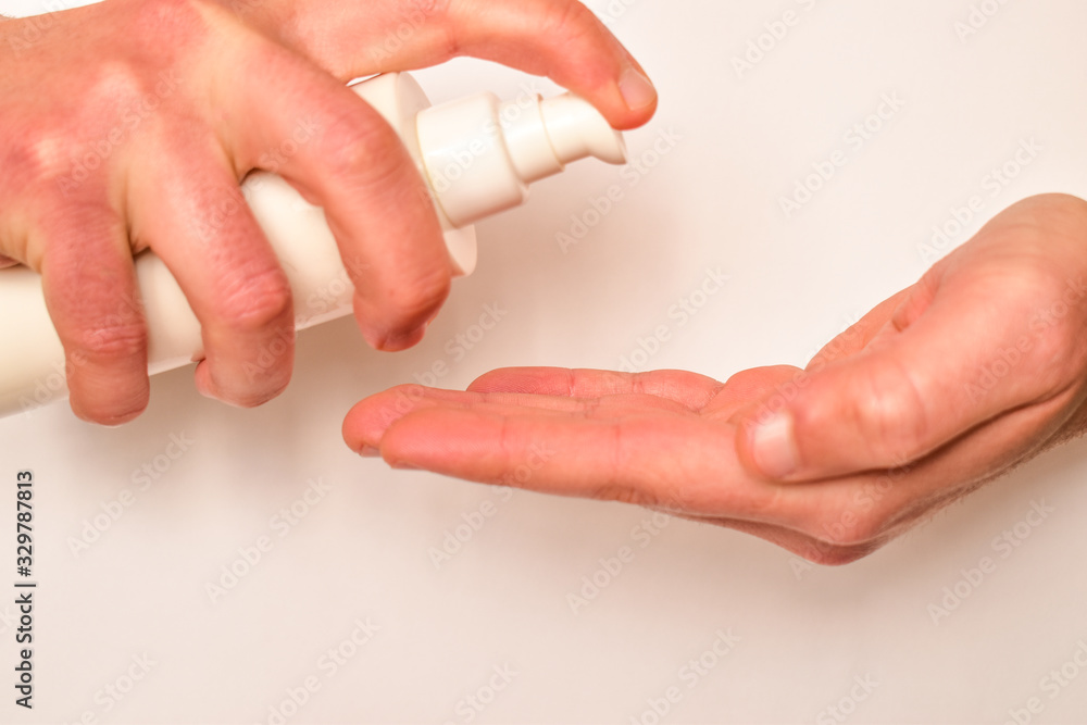 Man opens hand for disinfection to viruses. Use cream to clean hands. Man opens hand for disinfection to viruses. Use cream to clean hands.