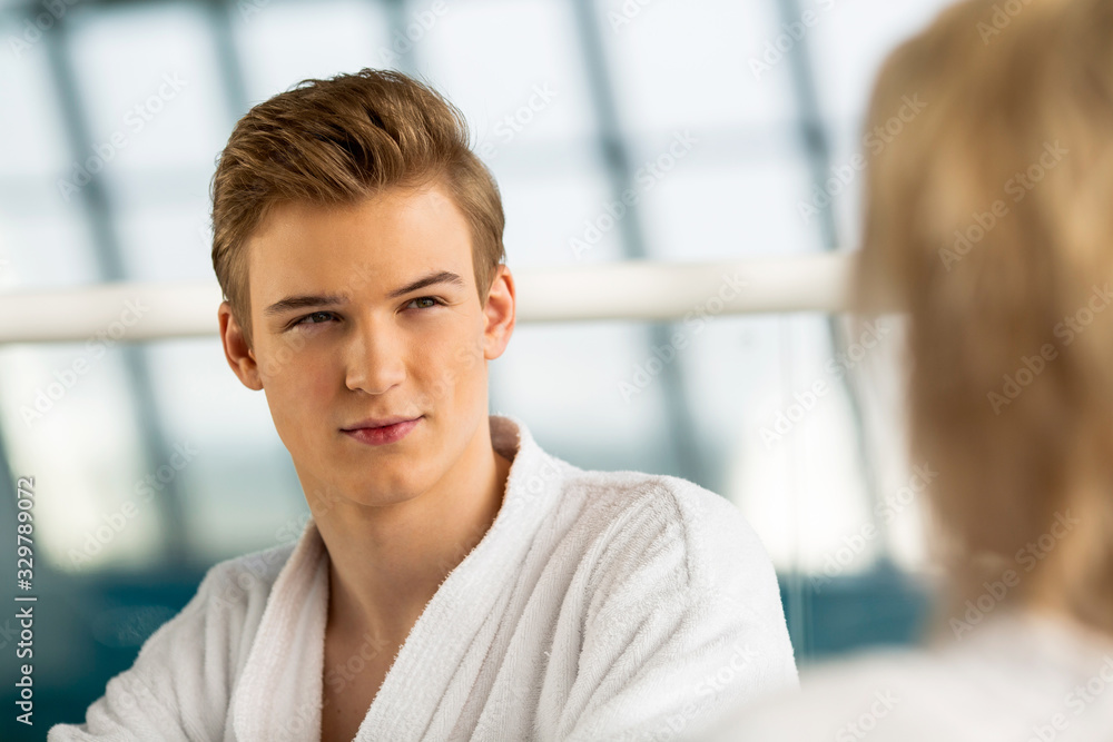 girl and guy talking on vacation in bathrobes girl and guy talking on vacation in bathrobes