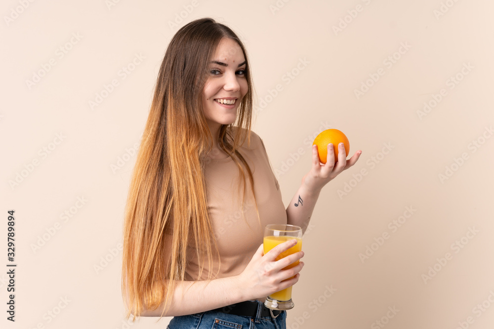Young caucasian woman holding an orange Young caucasian woman holding an orange