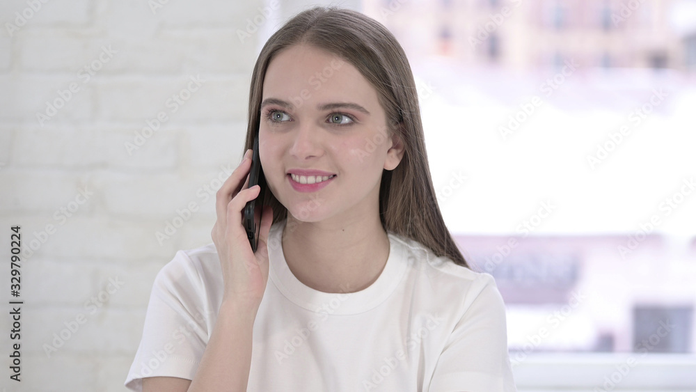 Portrait of Cheerful Young Woman Talking on Smartphone Portrait of Cheerful Young Woman Talking on Smartphone