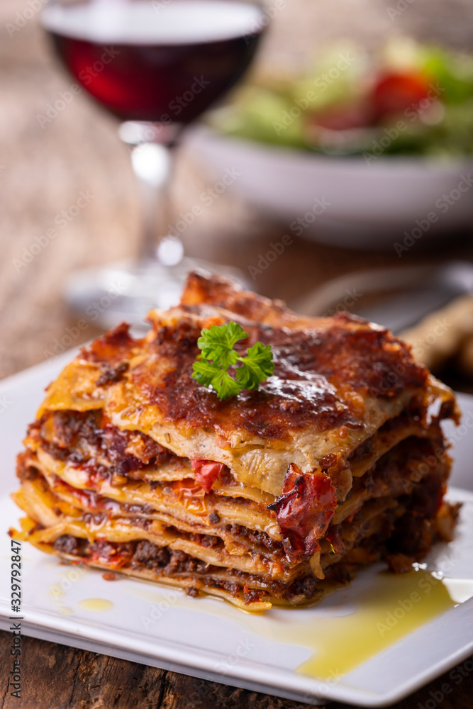 portion of lasagna on a plate portion of lasagna on a plate