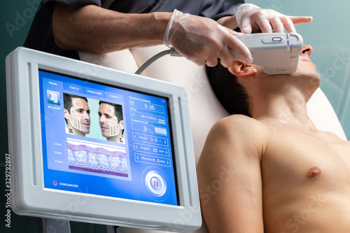 Digital hifu treatment interface with patient in background. photo