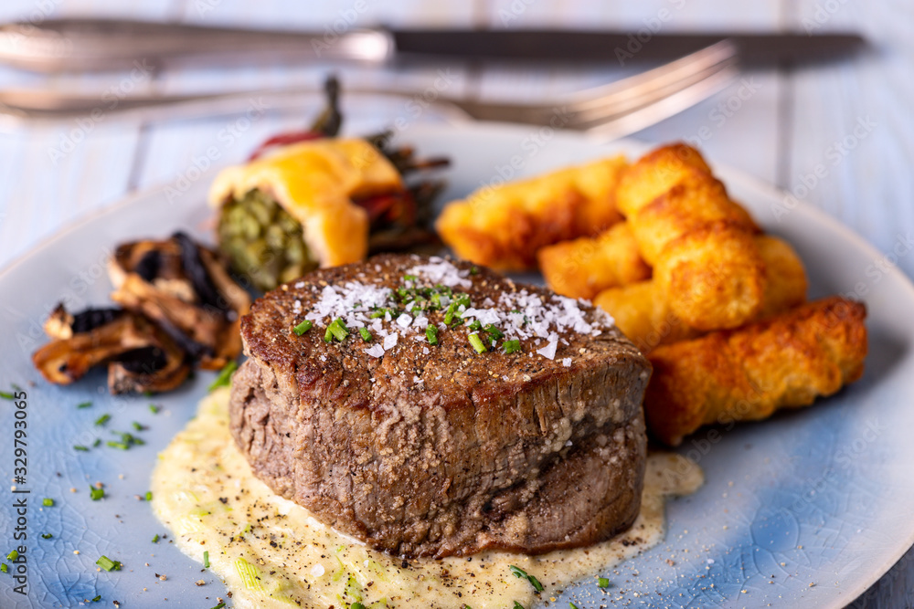 closeup of a steak on a plate closeup of a steak on a plate
