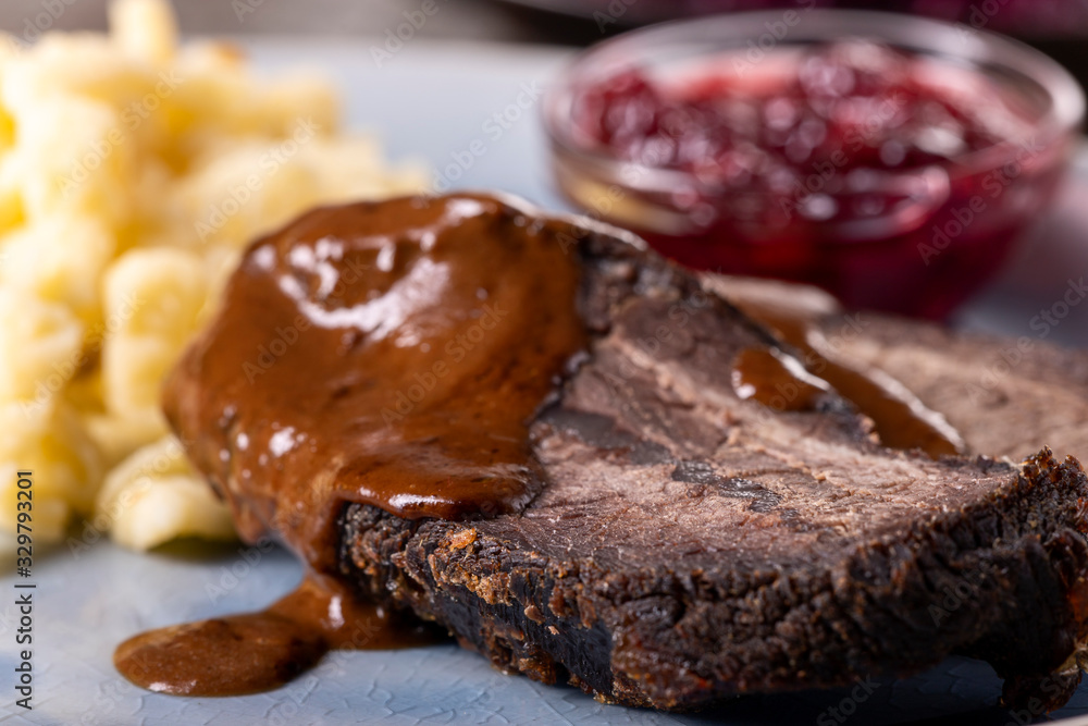 closeup of a german sauerbraten with dumplings closeup of a german sauerbraten with dumplings