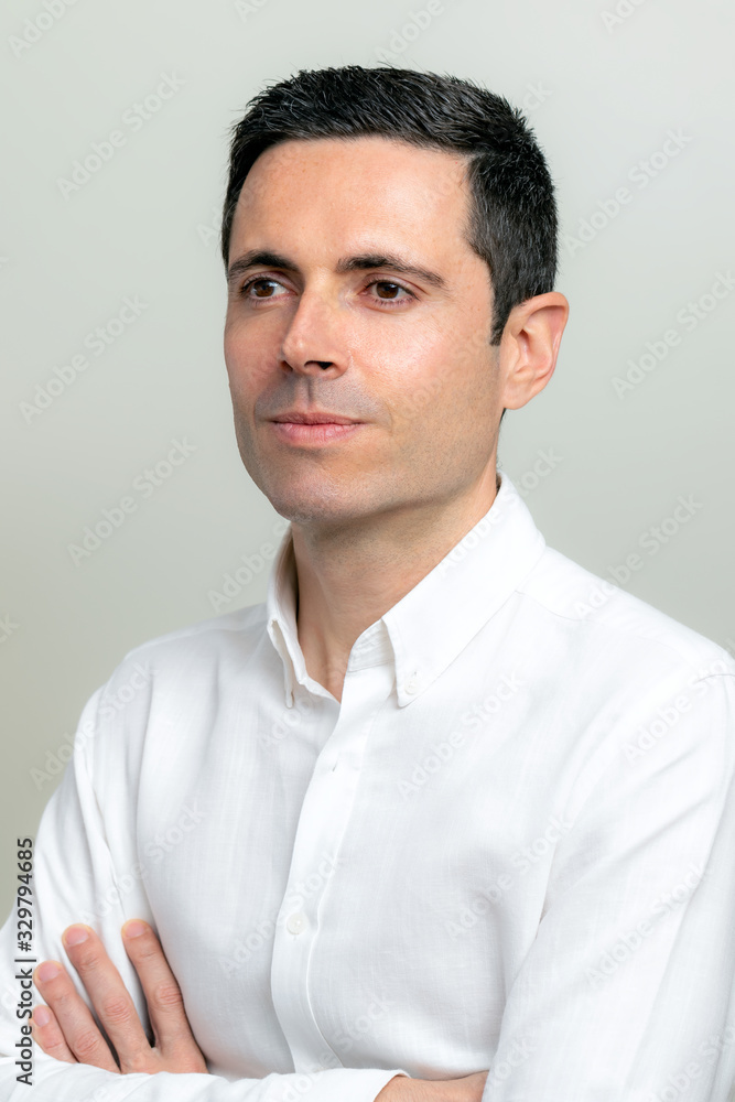Studio portrait of middle aged man looking aside. Studio portrait of middle aged man looking aside.