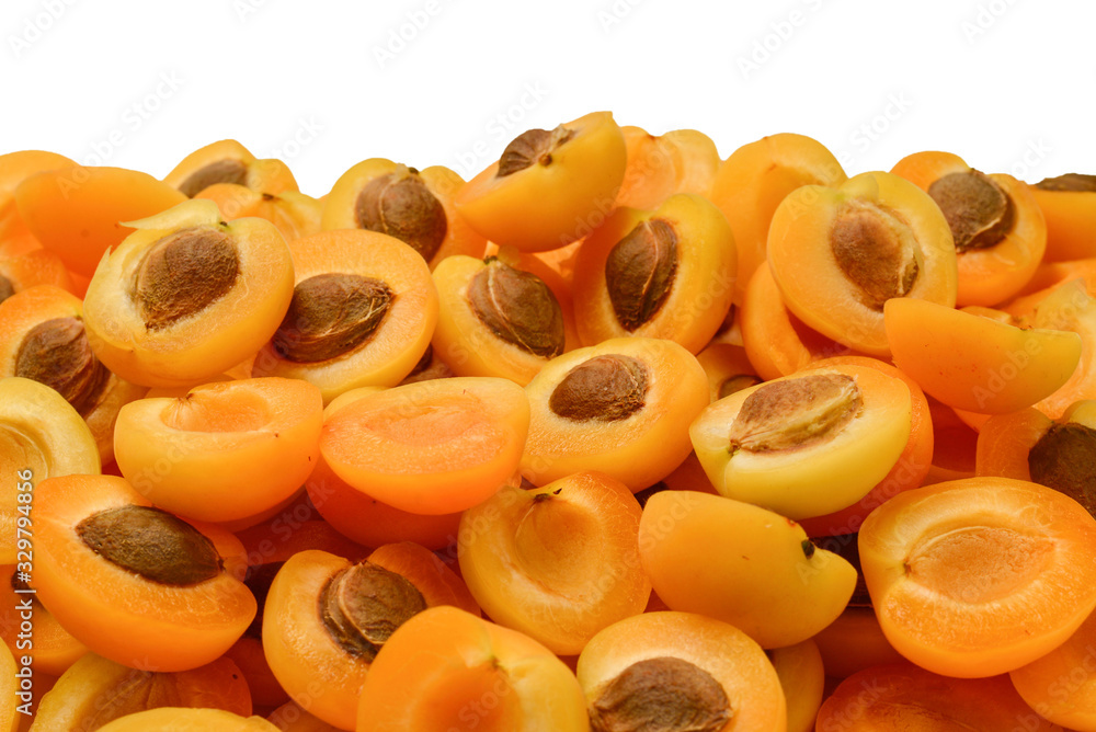 Ripe juicy orange apricots slices fruit background.