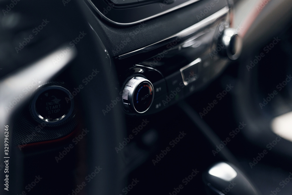 Leather car interior. Modern car illuminated dashboard. Luxurious car instrument cluster. Close up shot of automobile instrument panel. Modern car interior dashboard and steering wheel Leather car interior. Modern car illuminated dashboard. Luxurious car instrument cluster. Close up shot of automobile instrument panel. Modern car interior dashboard and steering wheel