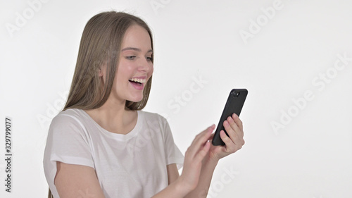 Beautiful Young Woman Celebrating on Smartphone, White Background