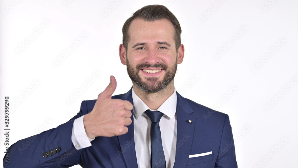 Portrait of Cheerful Young Businessman showing Thumbs Up, White Background Portrait of Cheerful Young Businessman showing Thumbs Up, White Background