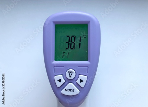Electronic thermometer in hand. Is used to measure a patient's temperature