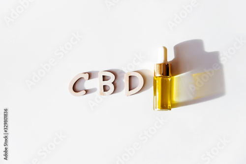 CBD oil  dropper bottle iand word cbd isolated on white photo