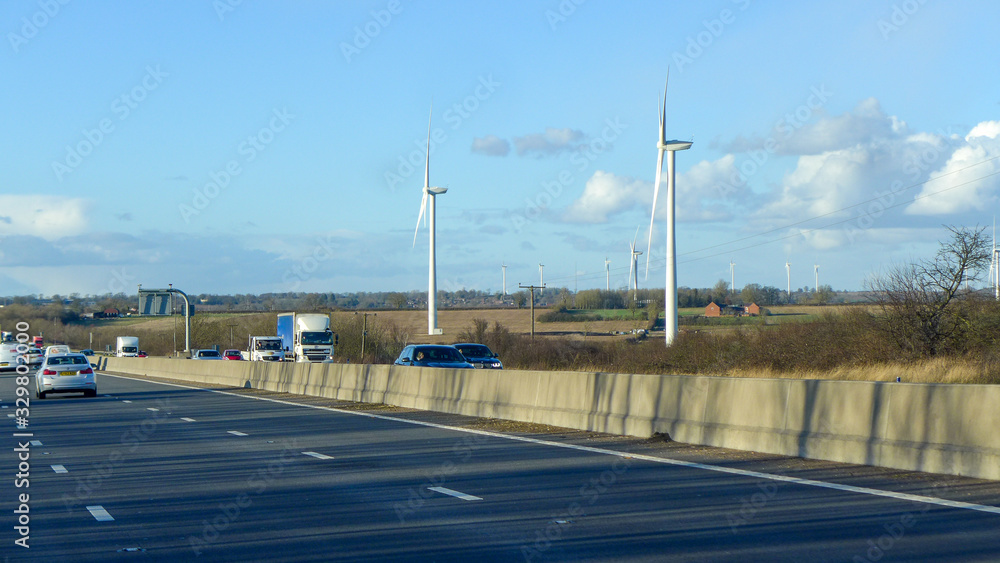 Windmill beside the motorway in England UK