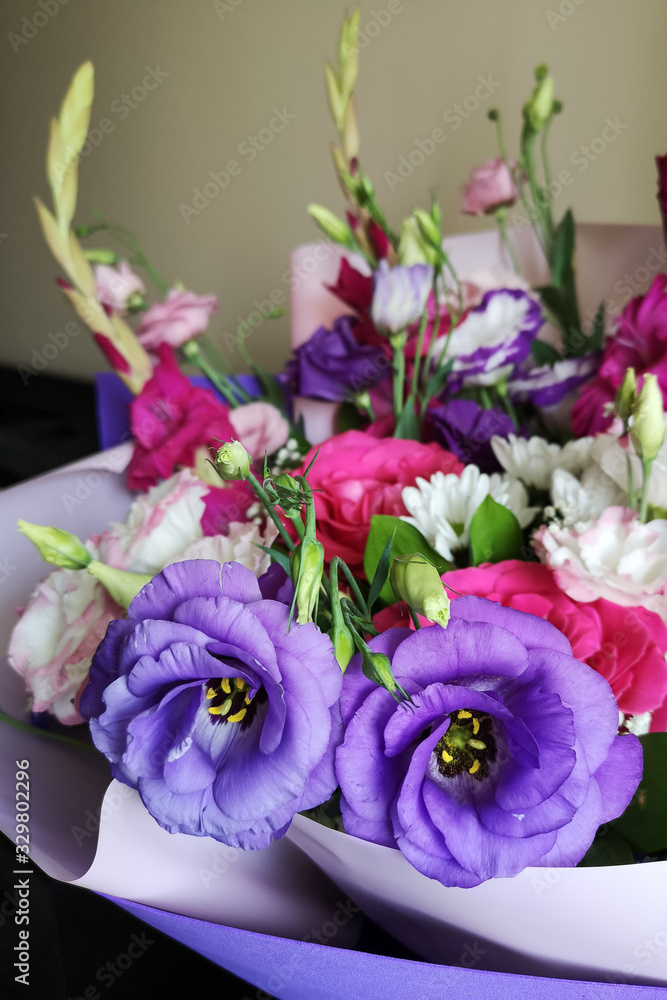 Beautiful large solemn bouquet in lilac pink tones. The bouquet consists of roses, pink gladioli, purple eustoma, white chrysanthemum and wrap in lilac paper and foamiran.