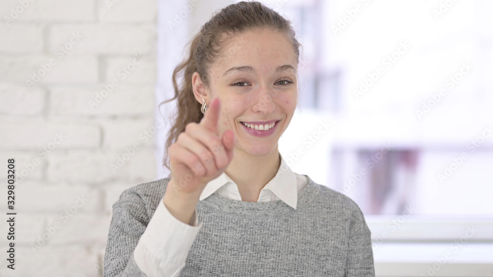 Portrait of Cheerful Young Latin Woman Pointing at Camera Portrait of Cheerful Young Latin Woman Pointing at Camera