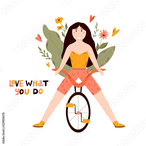 Young happy girl riding bicycle. LOVE WHAT YOU DO