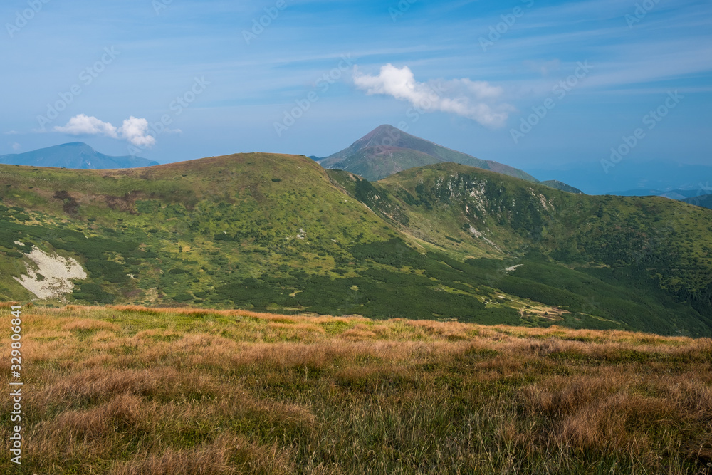 Summer landscape in mountains and the dark blue sky with clouds Summer landscape in mountains and the dark blue sky with clouds