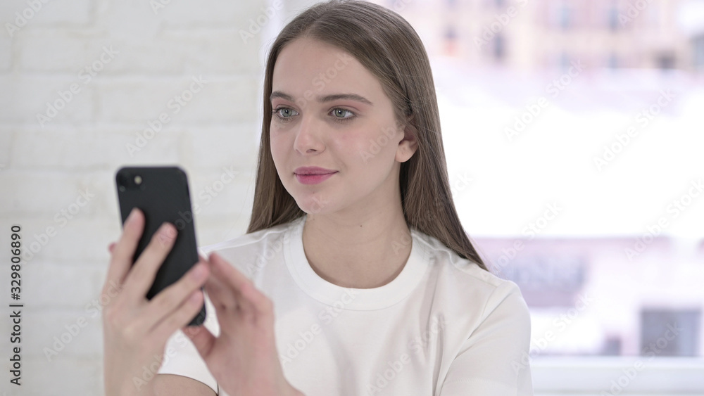 Portrait of Focused Young Woman using Smartphone Portrait of Focused Young Woman using Smartphone