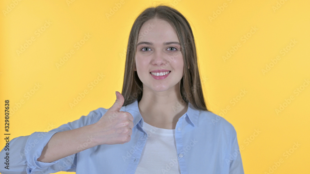 Cheerful Casual Young Woman showing Thumbs Up Cheerful Casual Young Woman showing Thumbs Up