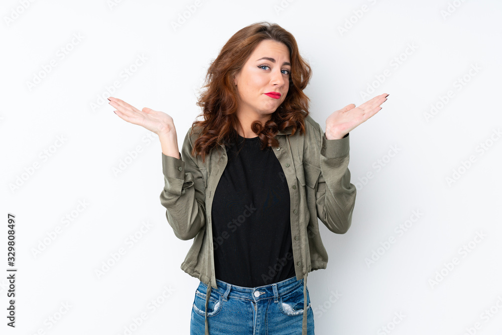 Young Russian woman over isolated white background making doubts gesture Young Russian woman over isolated white background making doubts gesture