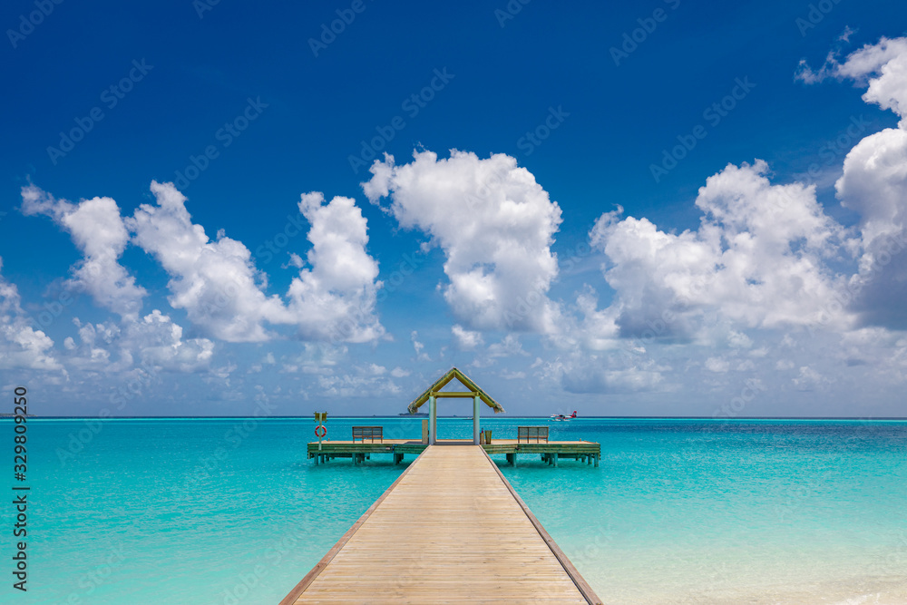Beautiful beach with jetty at Maldives. Amazing summer vacation or travel background in Maldives island. 