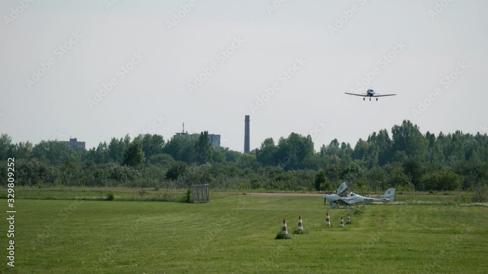 Ultralight small private aircraft airplane flying in the sky over the airfield. Aviation festival holiday at the aerodrome airport Ultralight small private aircraft airplane flying in the sky over the airfield. Aviation festival holiday at the aerodrome airport