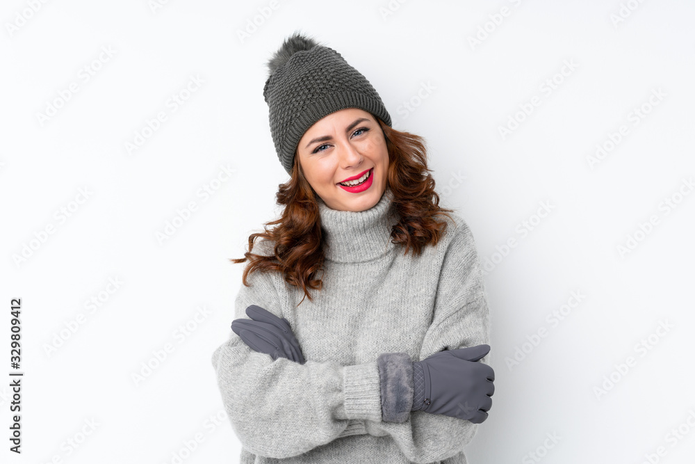 Young Russian woman with winter hat over isolated white background laughing Young Russian woman with winter hat over isolated white background laughing