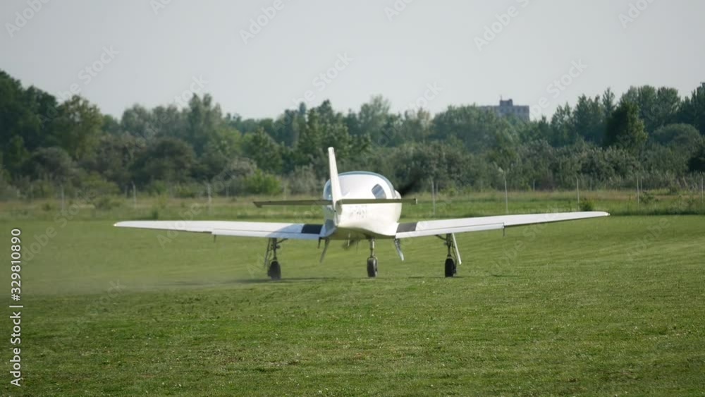 Ultralight small private aircraft airplane moving on the airfield. Aviation festival holiday at the aerodrome airport Ultralight small private aircraft airplane moving on the airfield. Aviation festival holiday at the aerodrome airport