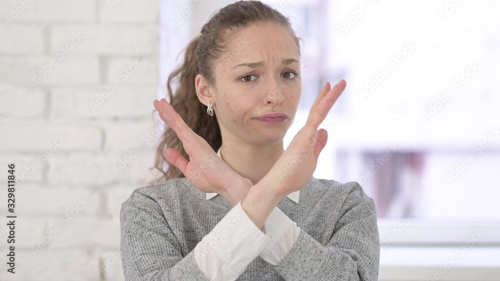 Rejecting Young Latin Woman saying No by Hand Gesture Rejecting Young Latin Woman saying No by Hand Gesture