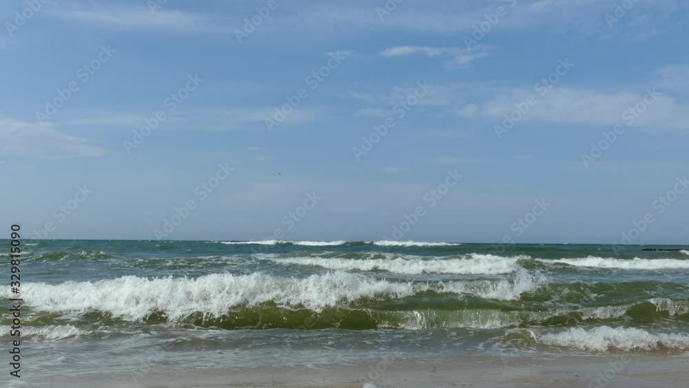 breaking of waves at baltic sea beach with blue sky 4k breaking of waves at baltic sea beach with blue sky 4k