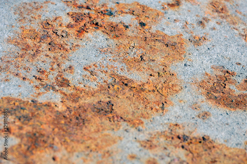 Orange rust on the metal surface.