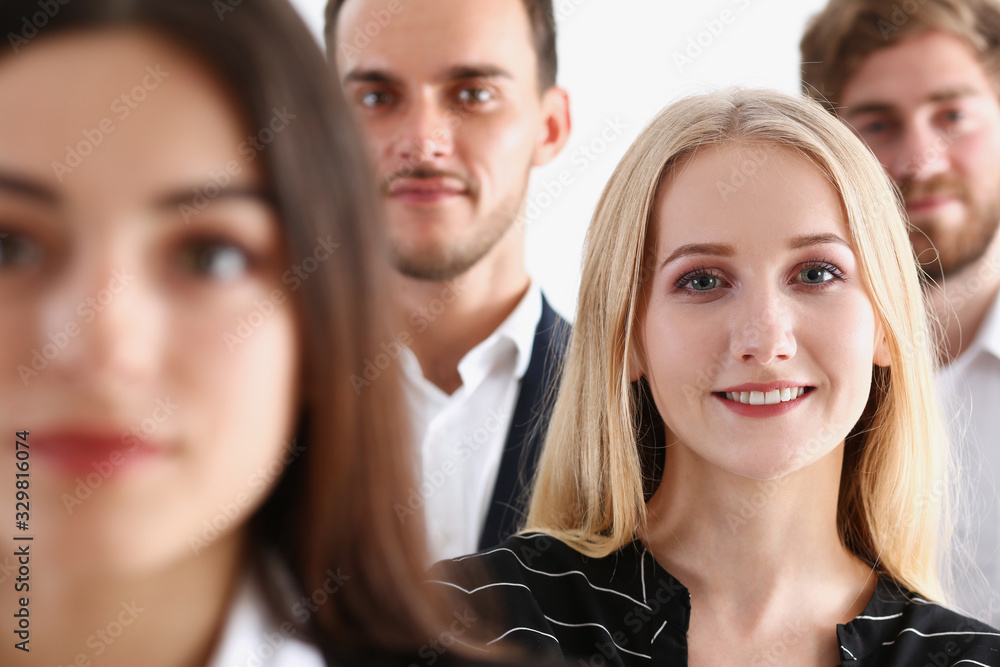 Obraz premium Group of smiling people stand in office looking in camera portrait. White collar power mediation solution project creative advisor participation profession train bank lawyer client visit concept