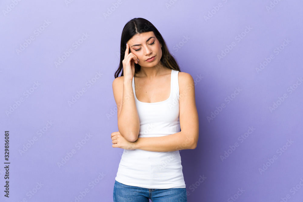 Young brunette woman over isolated purple background with headache Young brunette woman over isolated purple background with headache