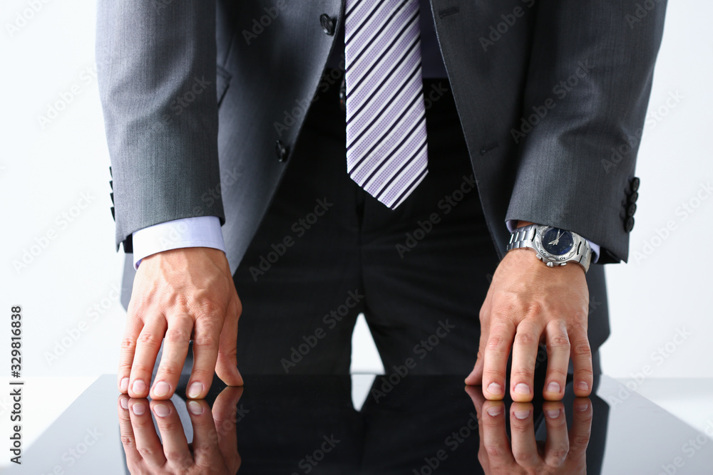 Obraz premium Empty arms of man in suit and tie closeup. White collar banker time watch wristwatch patience make decision strong control head of the board council concept