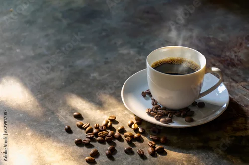 Obraz coffee cup coffee beans on the cement  background with smoky aroma