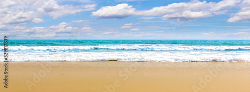 Fototapeta Naklejka Na Ścianę i Meble -  Panorama Tropical beach Natural background for summer vacation. Panorama Photo Turquoise ocean water and blue sky with clouds in sunny day. Beautiful beach with white sand