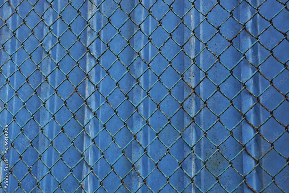 blue iron mesh metal texture on fence wall