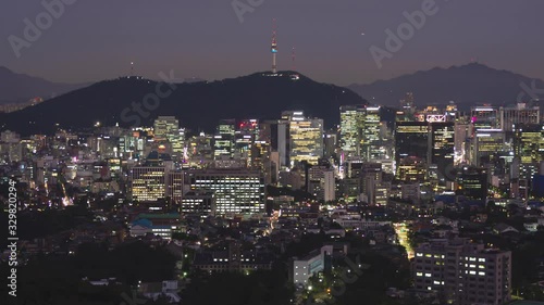 Time lapse day to night shot of Seoul cityscape view from Samcheong Park, South Korea photo