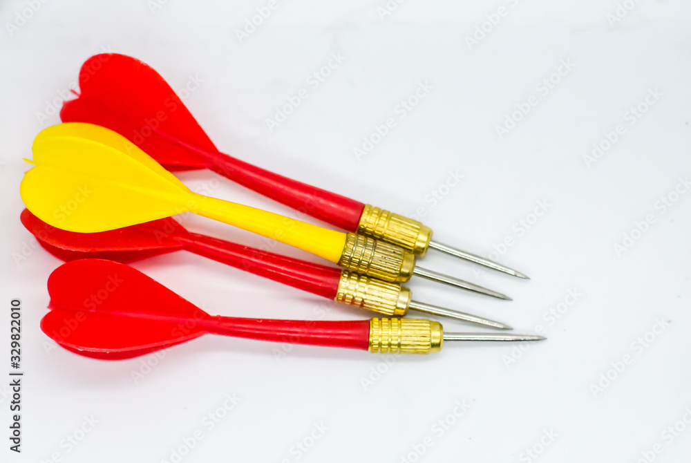 Three Red and one Yellow darts in the same direction. Concept the odd one to hit the target. Three Red and one Yellow darts in the same direction. Concept the odd one to hit the target.