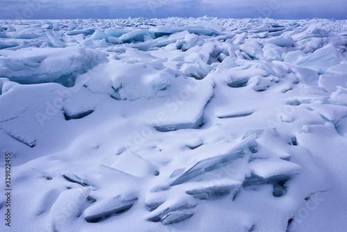 Landscape of blue ice shards and snow covered shoreline of Lake Michigan  Empire Beach  Sleeping Bear Dunes  Michigan  USA