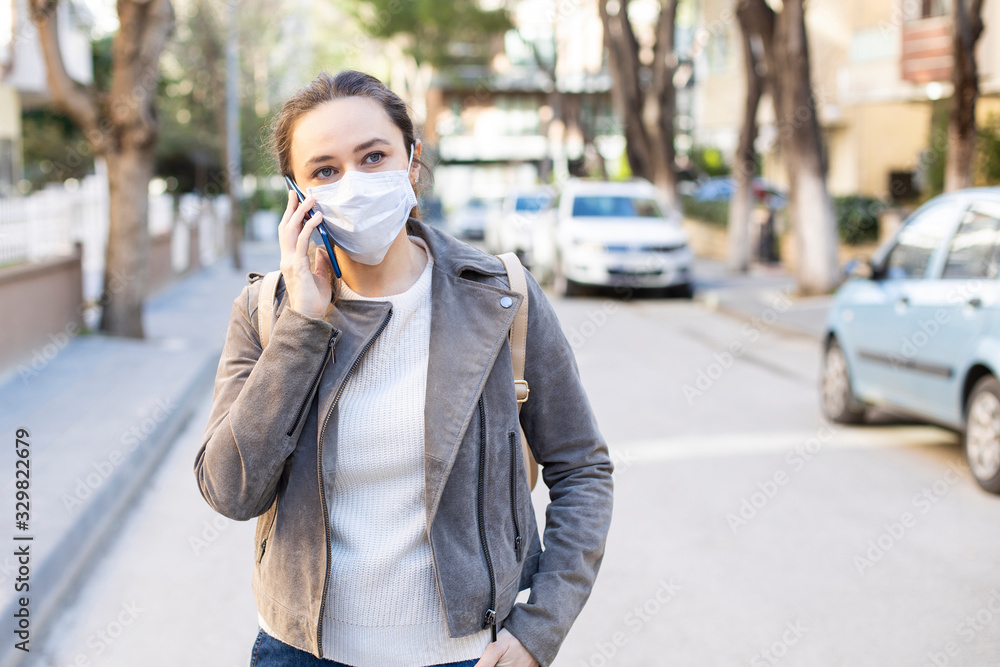 Fototapeta premium Young woman in medical face protection mask