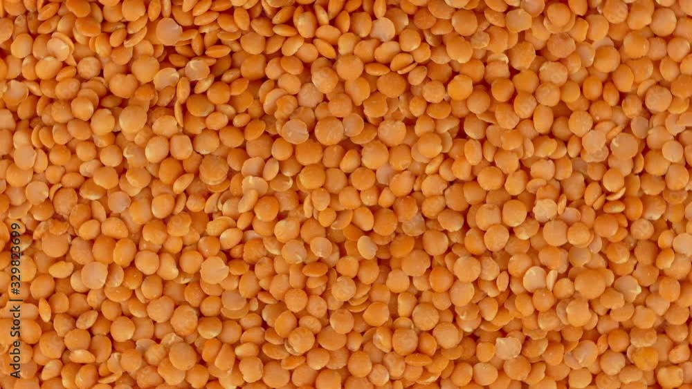 red lentils top view rotating background texture closeup 4k red lentils top view rotating background texture closeup 4k
