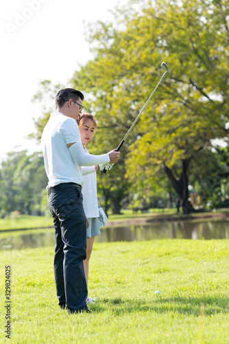 Trainer golf tutor practice for new golf player.