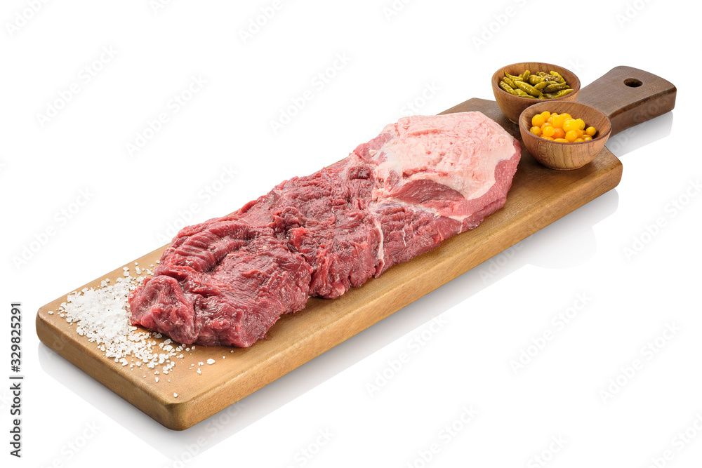 Raw filet mignon, a steak cut of beef taken from the smaller end of the tenderloin, or psoas major of the cow, ready to be cooked. On a cutting board, isolated on white background Raw filet mignon, a steak cut of beef taken from the smaller end of the tenderloin, or psoas major of the cow, ready to be cooked. On a cutting board, isolated on white background