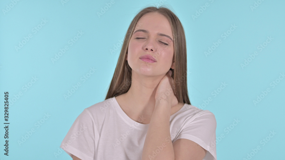 Tired Beautiful Young Woman having Neck Pain, Blue Background Tired Beautiful Young Woman having Neck Pain, Blue Background